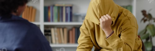 Preview: Header Image Crying Young Man in Therapy Session