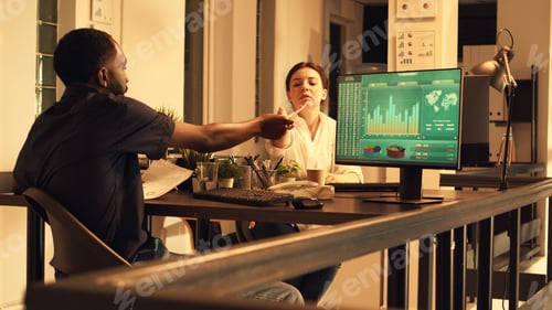 Preview: Office worker analyzing financial data on computer