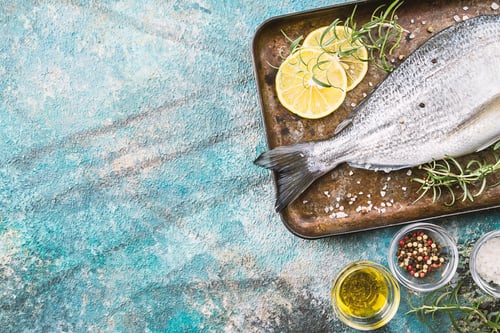 Preview: Fresh Fish and Lemons on a Baking Sheet