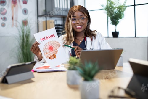 Preview: Afro-american doctor showing infographics with migraine desease to camera, consulting patient online