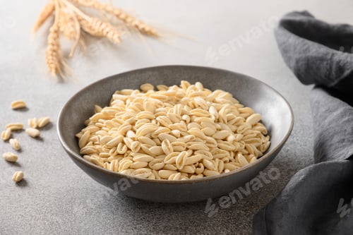 Preview: Pasta Cavatelli in bowl on gray background.