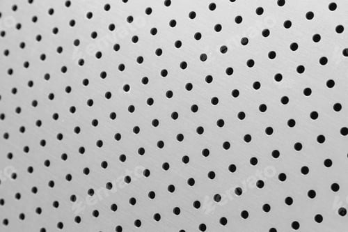 Preview: Close-up of white metal surface of smooth wall with round openings
