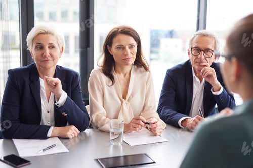 Preview: Business people having a conversation at conference table