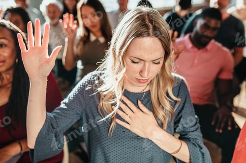 Preview: White woman raising her hand