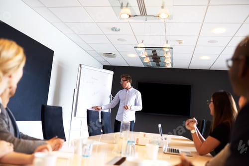 Preview: White male executive leading a work meeting