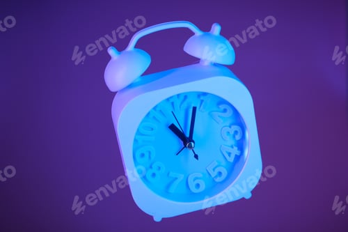 Preview: Light blue alarm clock suspended in air on a bright purple background