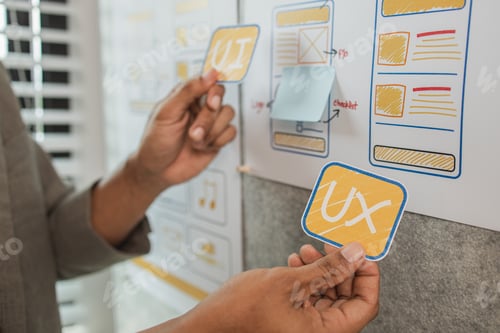Preview: UI UX designers team working on new website wireframe in office