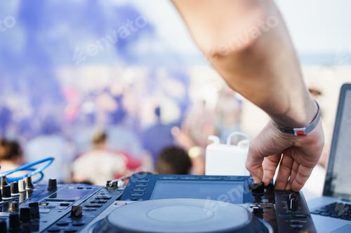 Preview: Dj mixing at beach party during summer vacation outdoor - Focus on right hand