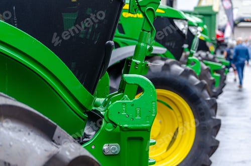 Preview: tractors in a row on exhibition at an agricultural machinery fair