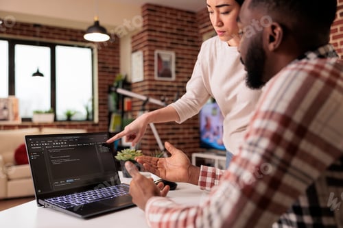 Preview: Programmers couple coding security firewall on laptop