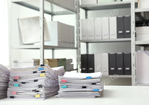 Preview: Stacks of documents with paper clips on office desk. Space for text