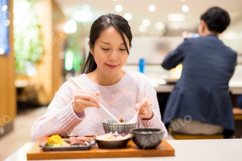 Preview: Woman enjoy her dinner at restaurant