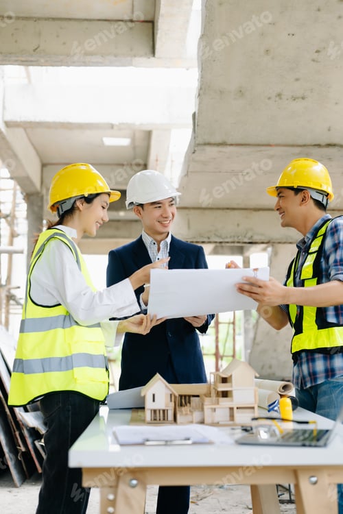Preview: Engineers and architects collaborating on-site with safety gear, blueprints, and tools