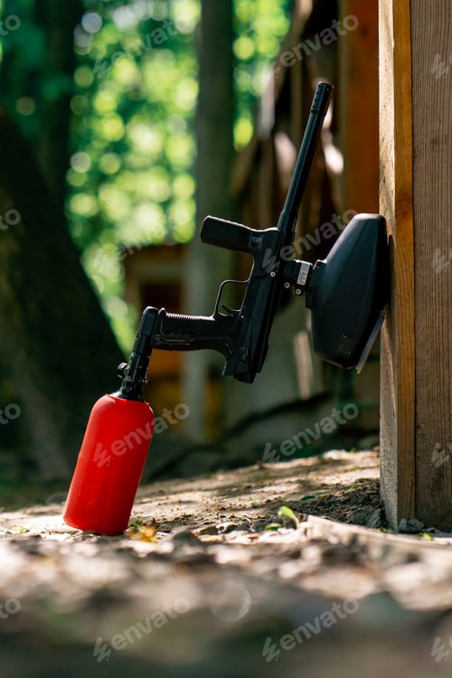 Preview: close up in the wild pintball a gun with red balloon near the wall active recreation active weekend