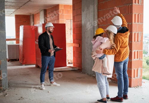 Preview: Family talking with builder at construction site.