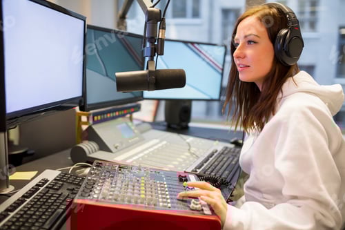 Preview: Female Host Using Control Panel At Radio Station