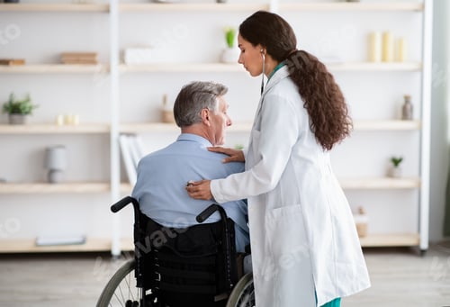 Preview: Doctor Examines Senior Man in Wheelchair