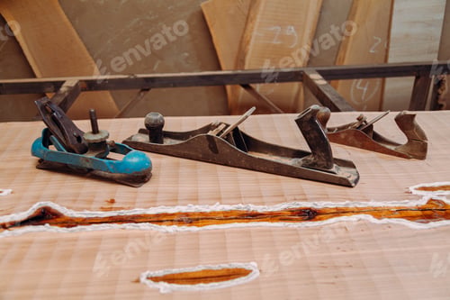 Preview: Old jointer planes laying on wood table