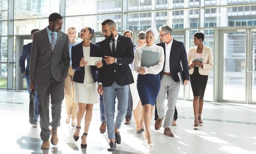 Preview: Business people walking together in lobby office
