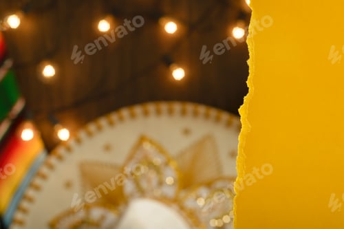Preview: Torn paper frame in front of festive mexican background. Cinco de mayo celebration.