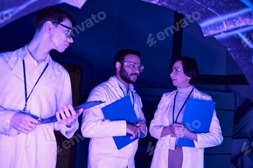 Preview: Futuristic Collaboration: Scientists of Varied Ages Converge in Neon-Lit Science Center