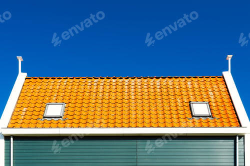 Preview: Tile roof and blue sky background. Old building. Architecture and construction.