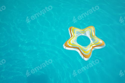 Preview: Star shaped inflatable ring floating in swimming pool on sunny day, above view. Space for text
