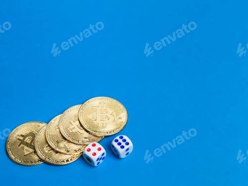 Preview: Photo of bitcoins and dices against blue background.