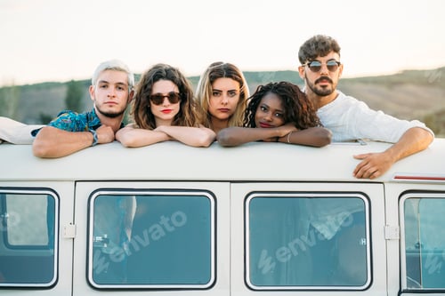 Preview: Young people standing in hatch of van roof