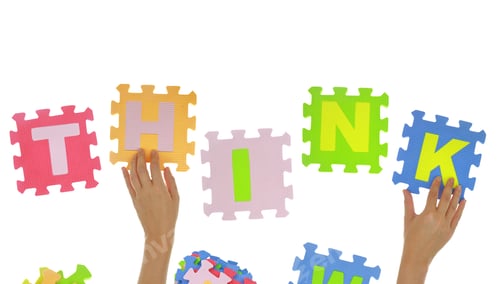Preview: Hands forming word "Think" with jigsaw puzzle pieces isolated