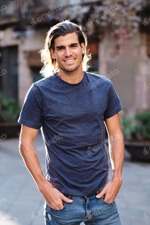 Preview: top model man using blue t-shirt and looking at camera for social media or dating apps