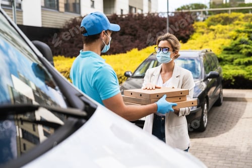 Preview: Safe delivery - courier on a van brings a pizza to the client