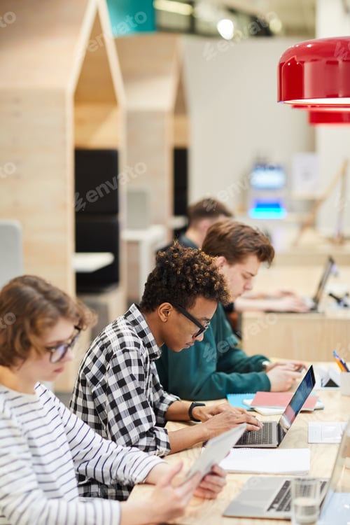 Preview: Students in line doing hometask in library