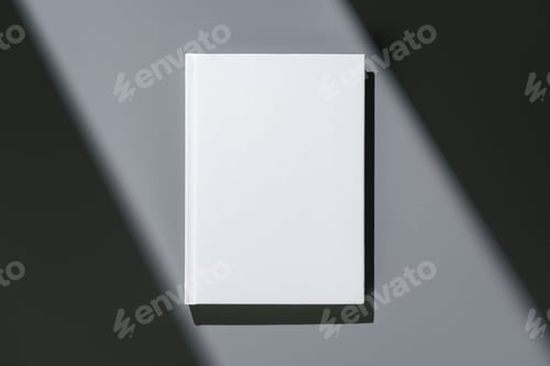 Preview: White notepad with hard cover on gray background