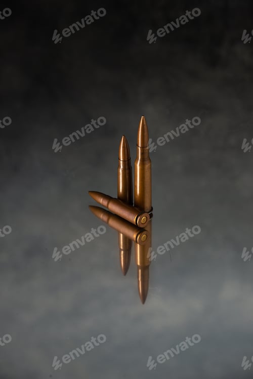 Preview: brown bullets on dark desk shooting gun tank death war