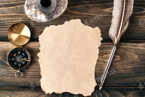Preview: Quill pen and old paper sheet on wooden background
