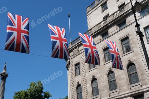 Preview: British flags hanging on the streets of London. Union jack flag triangular outside decoration.