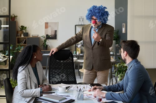 Preview: Clown boss talking to young subordinates