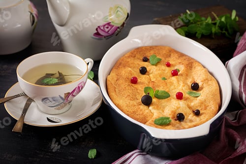 Preview: Breakfast. Appetizing cottage cheese casserole on dark table.