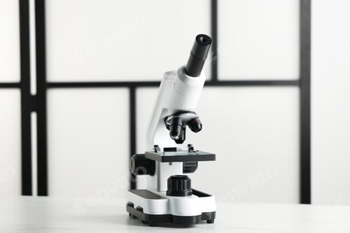 Preview: Modern medical microscope on white table indoors