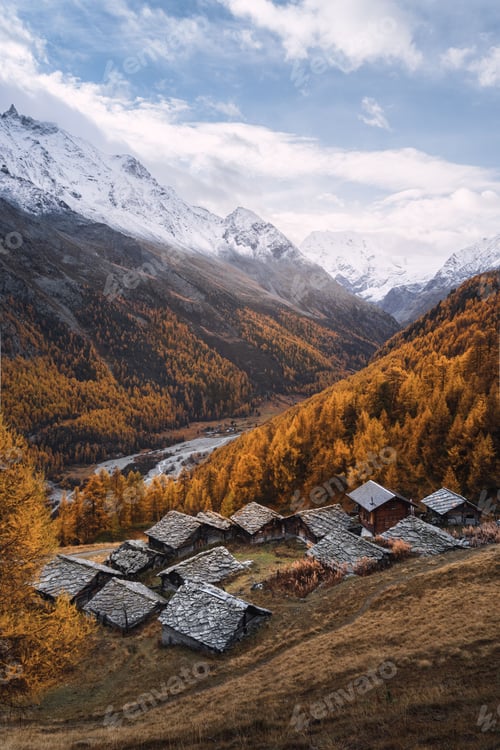 Preview: Autumnal mountain scenery with typical Swiss chalets in Arolla, Valais, Switzerland