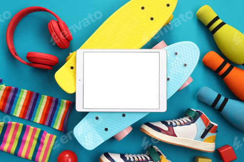 Preview: Flat lay composition with modern tablet on light blue background. Space for text