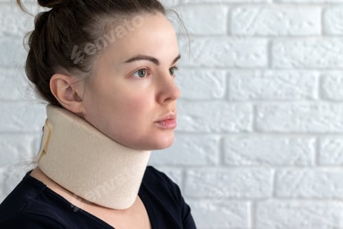 Preview: Woman with cervical surgical collar feeling pain in neck