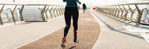 Preview: Young sportswoman with prosthesis running while working out