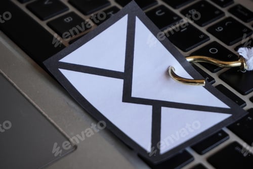 Preview: Closeup image of mail with hook on top of keyboard.