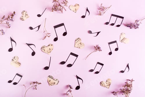 Preview: Love music concept. Background from paper hearts, music notes and dry flowers on pink. Top view.