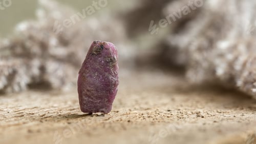 Preview: Rough Uncut Pinkish Ruby Stone on Wood Background