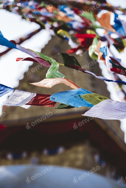 Preview: Vertical low angle shot of cloths hanging from a string with a blurred background