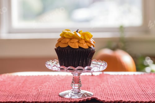 Preview: Orange frosted chocolate cupcake