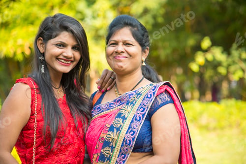 Preview: Portrait of happy mother and daughter embracing.